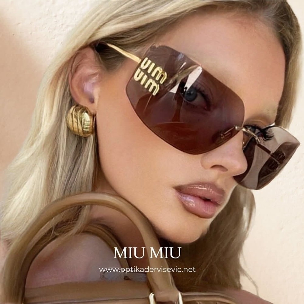 Miu Miu Black and Gold Sunglasses